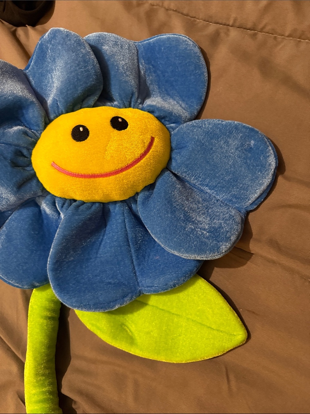 Fiesta Blue Plush Smiling Flower with Yellow Face and Green Stem